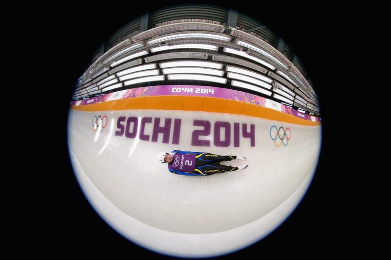 Andriy Mandziy of Ukraine in action during a Men's Singles Luge  training session ahead of the Sochi 2014 Winter Olympics at the Sanki Sliding Center on Friday. (Image was created using a fish eye lens)  Alex Livesey / Getty Images