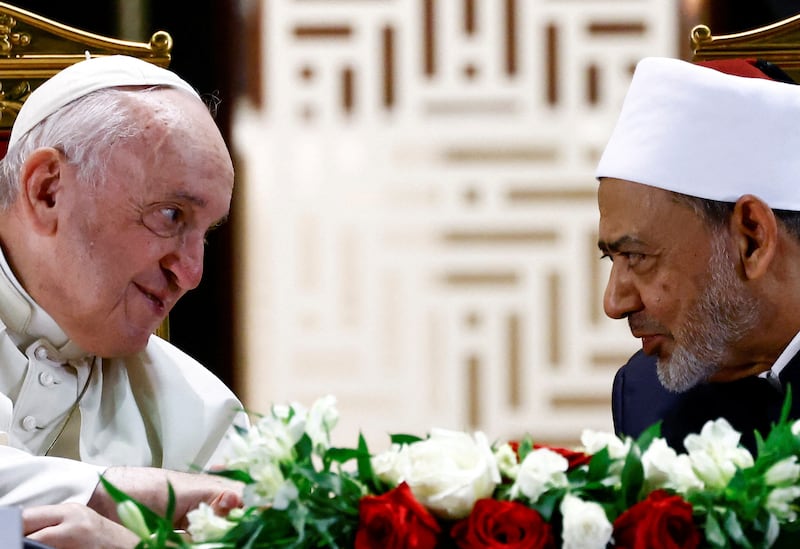Pope Francis and Grand Imam of Al-Azhar Ahmed Al-Tayeb look each other as they attend a meeting with members of the council of elders at the courtyard of the Mosque of Sakhir Palace during Pope Francis' apostolic journey, in south of Manama, Bahrain. Reuters