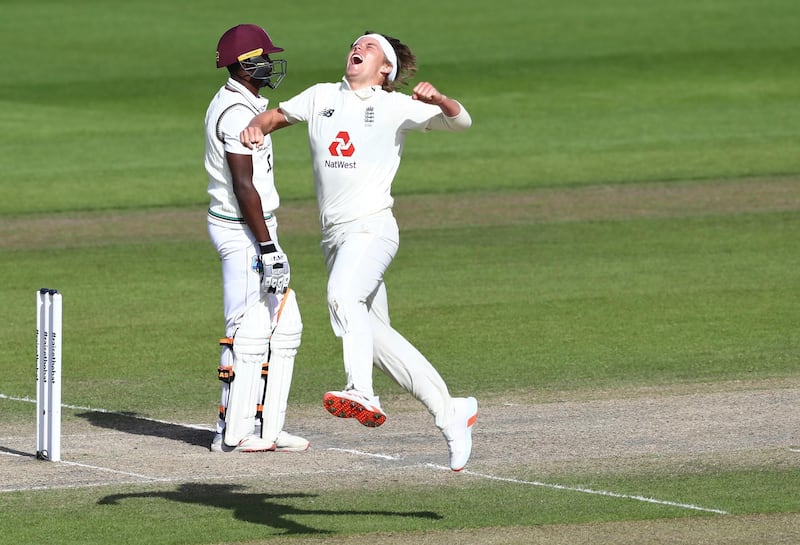 England's Sam Curran, right, celebrates the dismissal of West Indies' Shamarh Brooks. AP