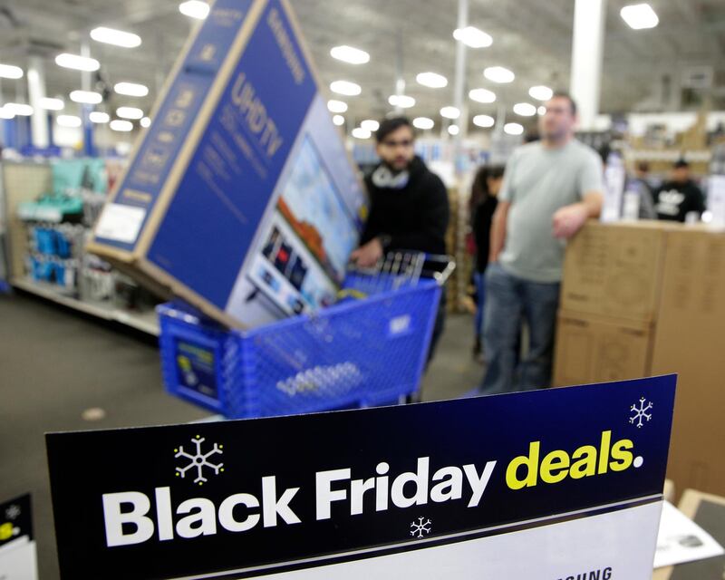 People wait in line to buy televisions at a Best Buy store in Overland Park, Kansas. AP Photo