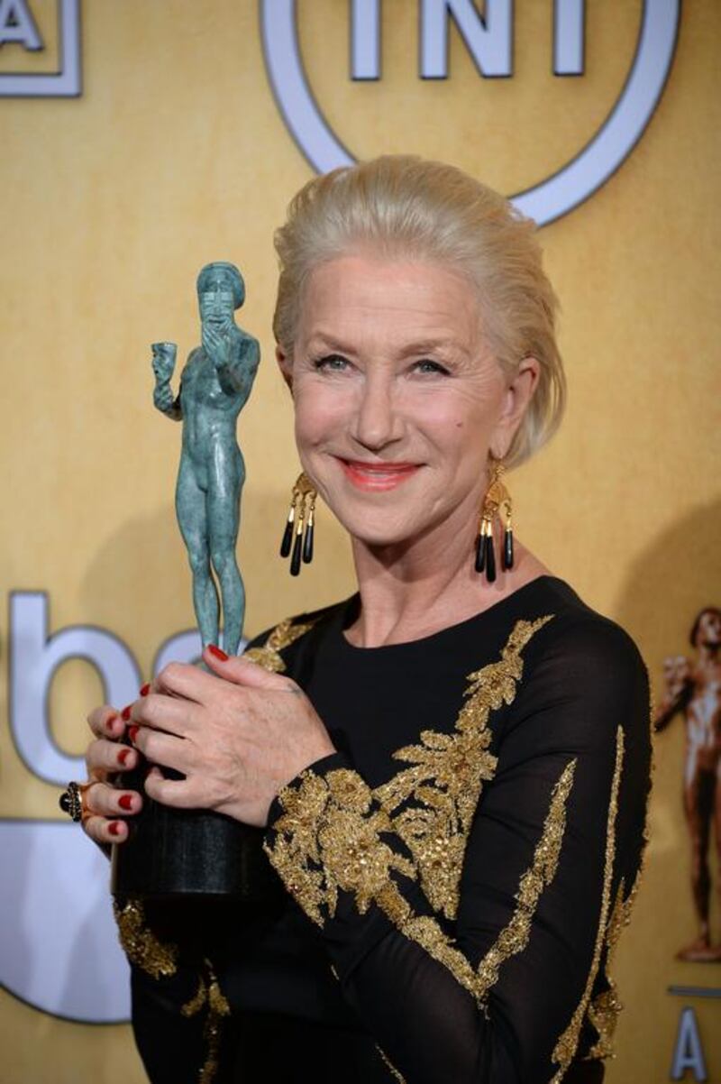 Helen Mirren, winner of the Best Female Actor in a Television Movie or Miniseries award, poses in the press room. AFP


