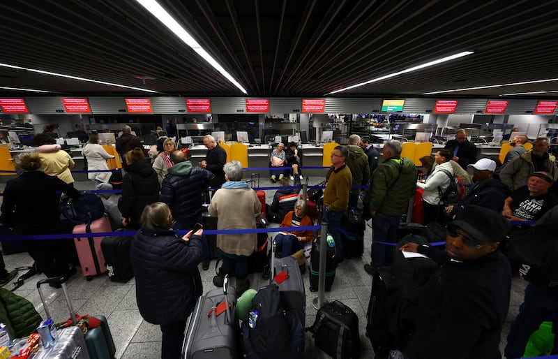 A queue of passengers at a Lufthansa check-in counter in Frankfurt. Reuters