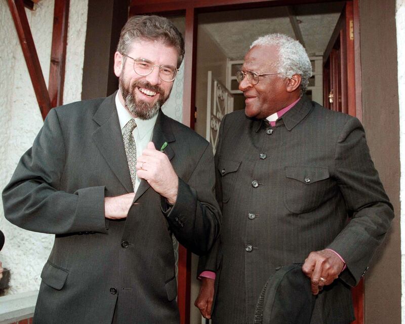The former leader of Northern Ireland's Sinn Fein, Gerry Adams, meets Tutu in Belfast. PA