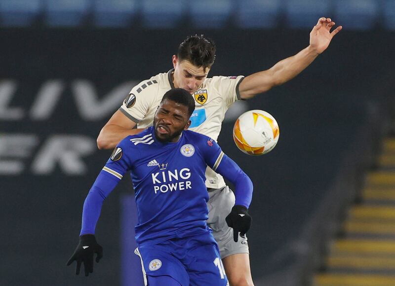 Leicester attacker Kelechi Iheanacho challenges for a header with AEK Athens' Ionut Nedelcearu. Reuters