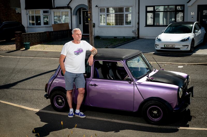 Karl Amos, 53, a plumbers' merchant in Hillingdon, with his 1985 Classic Mini. 'When I first built this car from the ground up, I said I'd be buried in it and I'd never thought I'd ever have to consider parting with it – it's left me heart-broken'