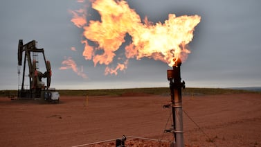 A flare burns natural gas at an oil well. AP