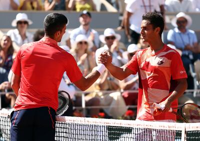 Novak Djokovic of Serbia shakes hands with Juan Pablo Varillas of Peru after winning their fourth-round match. EPA