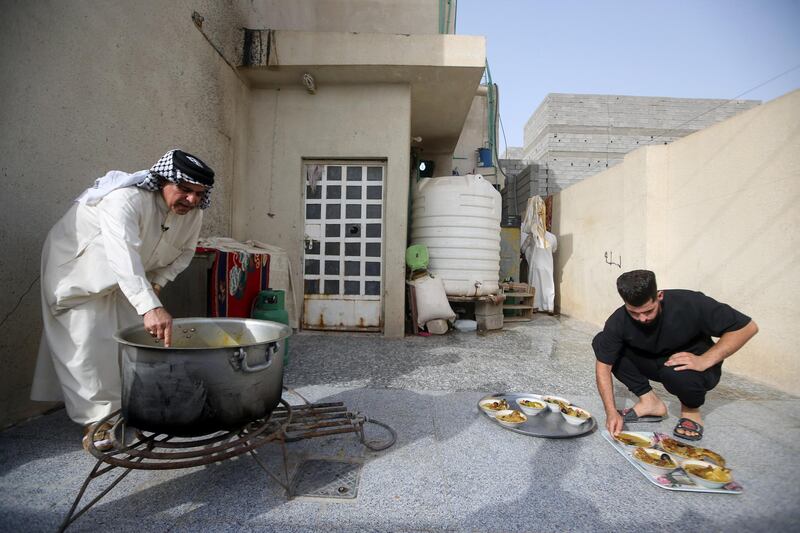 Basra residents cook masmouta, a traditional meal in the southern Iraqi city, during Eid Al Fitr. Reuters