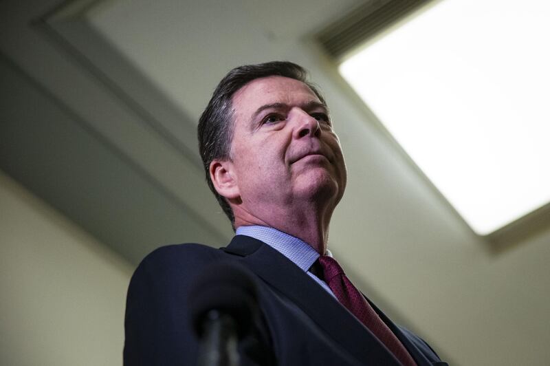 James Comey, former director of the Federal Bureau of Investigation (FBI), pauses while speaking to members of the media after testifying before the House Judiciary and House Oversight and Government Reform Committees joint investigation in Washington, D.C., U.S., on Friday, Dec. 7, 2018. Comey said he'll return for a second meeting with House lawmakers after a day of closed-door questioning that he said was related mostly to Hillary Clinton's emails. Photographer: Al Drago/Bloomberg