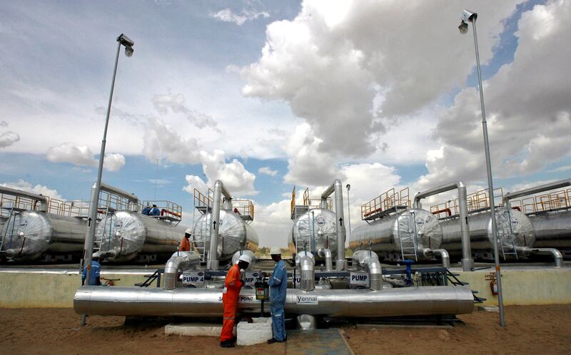 Cairn India employees work at a storage facility for crude oil at Mangala oil field at Barmer in the desert Indian state of Rajasthan. The rising number of Covid-19 cases also has the potential to derail demand, which has picked up since the beginning of the year due to vaccination campaigns and slow ease of restrictions. REUTERS.