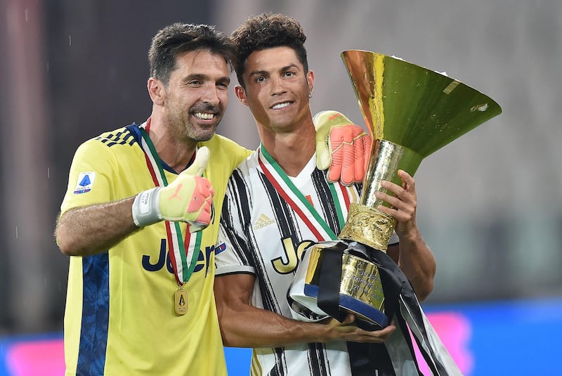 Goalkeeper Gigi Buffon and Cristiano Ronaldo celebrate. EPA