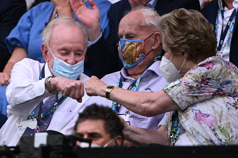 Rod Laver, left, and and Neale Fraser, centre, attend the Australian Open women’s singles final on Saturday. Getty