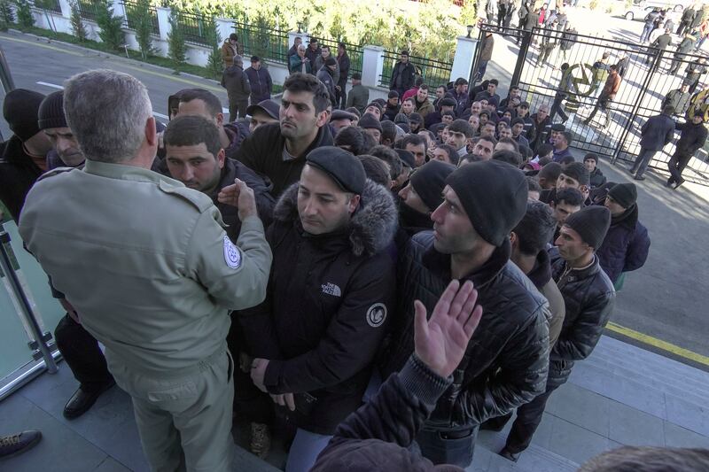 Voters queue up outside a polling station in Fuzuli, Karabakh. AP