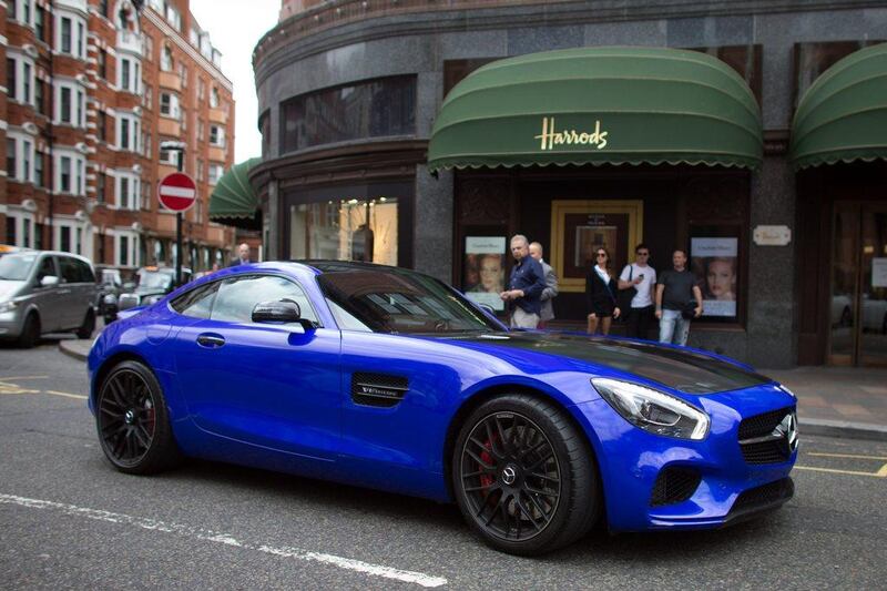 A Qatari-registered Mercedes v8 biturbo AMG GTS is driven past Harrods. Carl Court / Getty Images