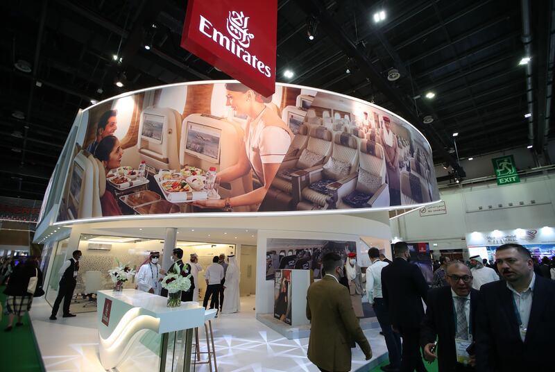 Visitors gather at the Emirates stand at the Arabian Travel Market in Dubai.  EPA