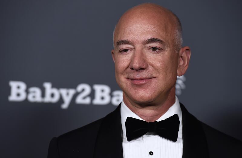 Amazon founder Jeff Bezos announced plans to donate much of his wealth to charity hours before it was reported the company was planning to cut thousands of jobs. AP