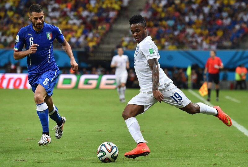 England midfielder Raheem Sterling prepares to play a cross as he's defended by Italy's Antonio Candreva during their 2014 World Cup Group D match on Saturday night in Manaus, Brazil. Ben Stansall / AFP