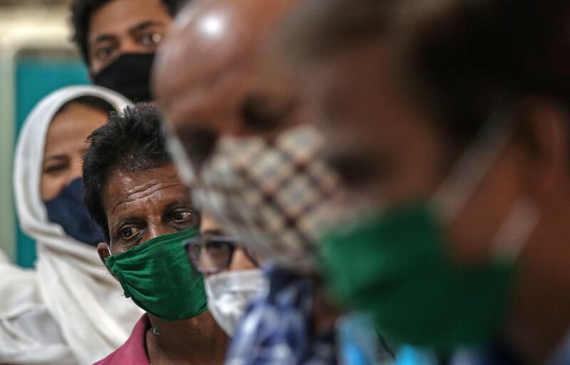 Beneficiaries wait for their turn to get her first dose of a Covid-19 vaccine shot, manufactured by Serum Institute of India, inside Vaccination Centre at Shatabdi Hospital in Mumbai, India.  EPA