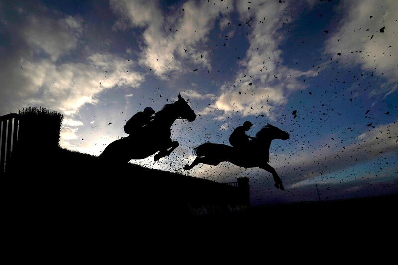 Runners and Riders clear a fence during the Newton King Estate Agents Handicap Chase at Taunton Racecourse on Wednesday, October 28. PA
