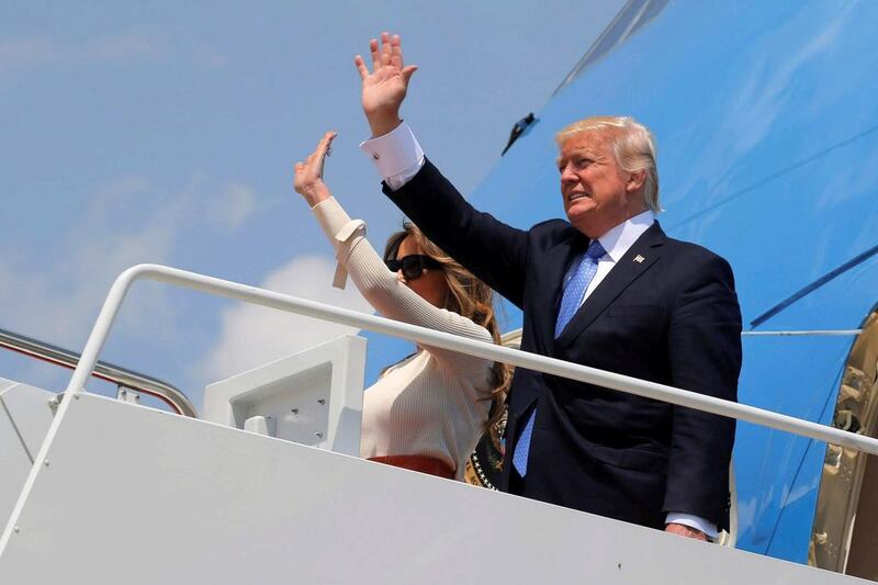 US president Donald Trump and first lady Melania Trump board Air Force One for his first international trip as president, which begins with a stop in the Saudi capital Riyadh, at Joint Base Andrews, Maryland, on May 19, 2017. Jonathan Ernst / Reuters