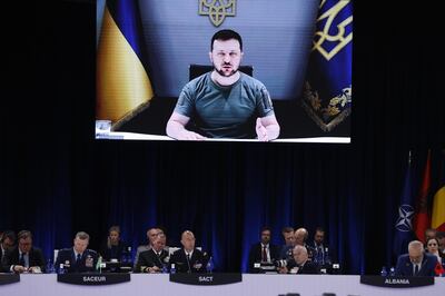 Ukrainian President Volodymyr Zelenskyy appears on the screen, as he delivers a speech by video conference during the first day of the Nato Summit in Madrid, Spain, on Wednesday.  EPA