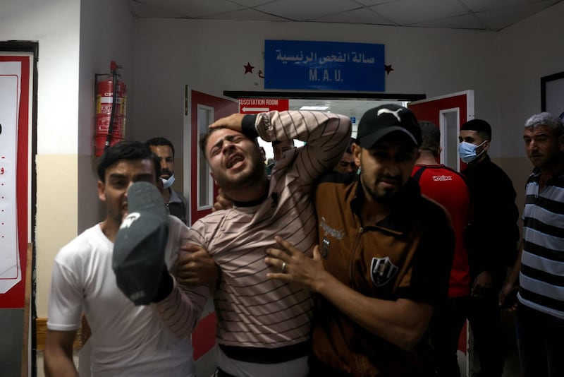 Palestinians at a hospital in the northern Gaza Strip. Nine people were killed amid air raids in the Gaza Strip, local authorities said. It was unclear whether the deaths were caused by the air strikes. Israel said it bombed Hamas targets in Gaza in response to rocket fire directed towards Israel. AFP