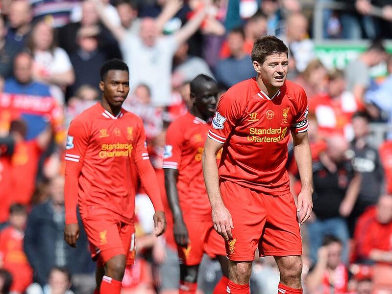 Steven Gerrard, right, and his Liverpool teammates react with dejection after allowing the second goal in a 2-0 Premier League loss to Chelsea at Anfield Stadium on April 27, 2014. Simon Bellis / Sportimage