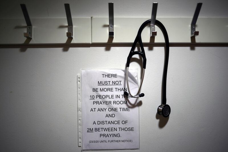 A stethoscope hangs on a coat hook at the entrance to the Muslim prayer room at the Royal Blackburn Teaching Hospital car park in Blackburn, May 14. Hannah Mckay/ AFP / Pool