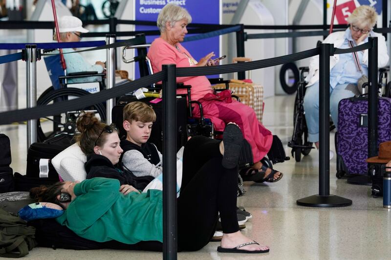Passengers wait for flights to resume. AP