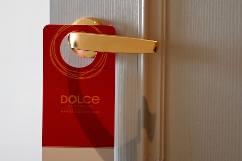 A placard hangs on a room's doorknob at Dolce Hanoi Golden Lake hotel. AFP