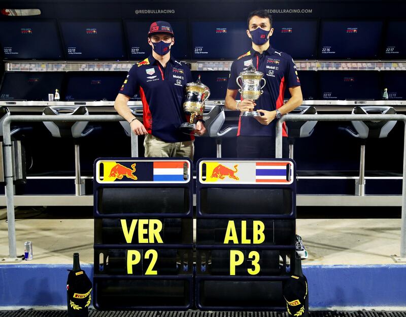 BAHRAIN, BAHRAIN - NOVEMBER 29: Second placed Max Verstappen of Netherlands and Red Bull Racing and third placed Alexander Albon of Thailand and Red Bull Racing celebrate with their trophies after the F1 Grand Prix of Bahrain at Bahrain International Circuit on November 29, 2020 in Bahrain, Bahrain. (Photo by Mark Thompson/Getty Images)