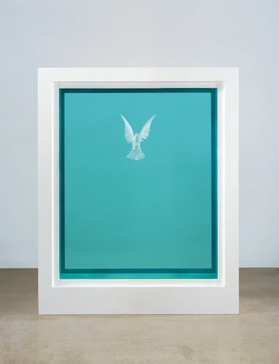 This undated photo provided by Christie's Images LTD. 2019, shows "The Incomplete Truth," a piece of art by Damien Hirst, presenting a dove in formaldehyde solution contained within glass, painted aluminum, silicone, acrylic and stainless steel. The item is one of more than 200 art pieces from music artist George Michael's private collection that will go up on the auction block in London in March. (Christie's Images LTD. 2017 via AP)