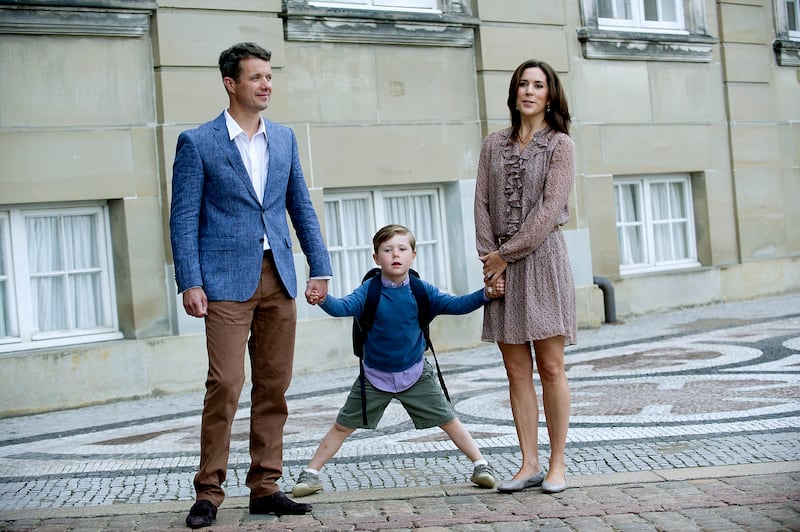 Prince Christian between his parents, Crown Prince Frederik and Crown Princess Mary on the way to his first day of school in Copenhagen, in 2011. EPA