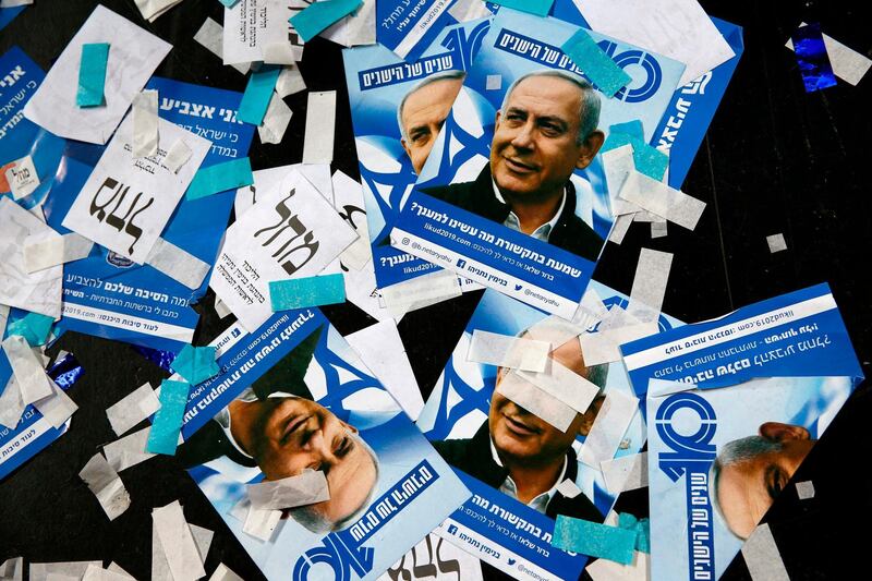 Israeli Likud Party campaign material and posters of Prime Minister Benjamin Netanyahu strown on the floor following election night at the party in Tel Aviv. AFP
