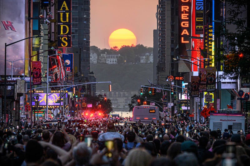 The Sun set in alignment with Manhattan streets running east-west, also known as Manhattanhenge.  AFP