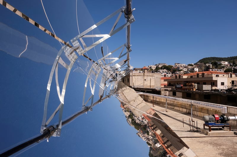 On the rooftop of a bakery in the Lebanese village of Remhala, concentrated solar power systems generate heat to operate a hybrid convection oven. All photos: Reuters
