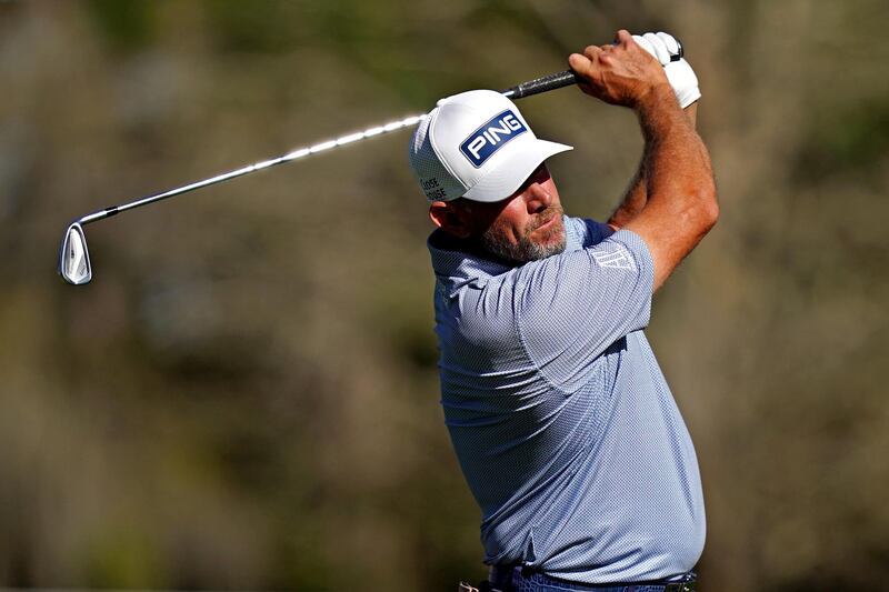 Lee Westwood, leader after the second round, plays his shot from the sixth tee. USA Today