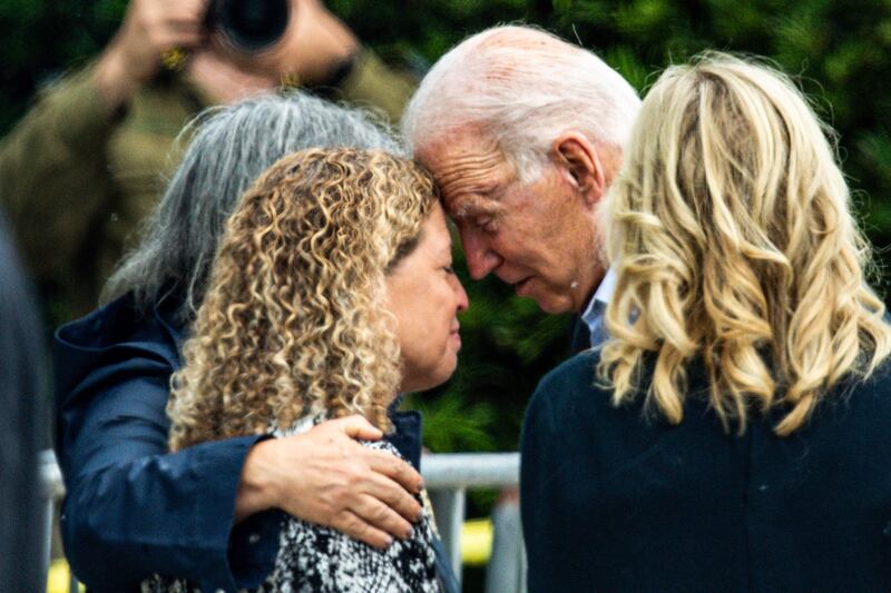 US President Joe Biden (R) and US First Lady Jill Biden (2R) meet Miami Dade County Mayor Daniella Levine Cava (2L) as he visit a photo wall, the 'Surfside Wall of Hope & Memorial', near the partially collapsed 12-story Champlain Towers South condo building in Surfside, Florida, July 1, 2021.  - President Joe Biden flew to Florida on July 1 to "comfort" families of people killed or still missing in the rubble of a beachfront apartment building, where hopes of finding survivors had all but evaporated.  Biden and First Lady Jill Biden left the White House early for the flight to Miami, and then traveled by motorcade to nearby Surfside, where the death toll in the tragedy now stands at 18, and more than 140 still unaccounted for.  (Photo by CHANDAN KHANNA  /  AFP)