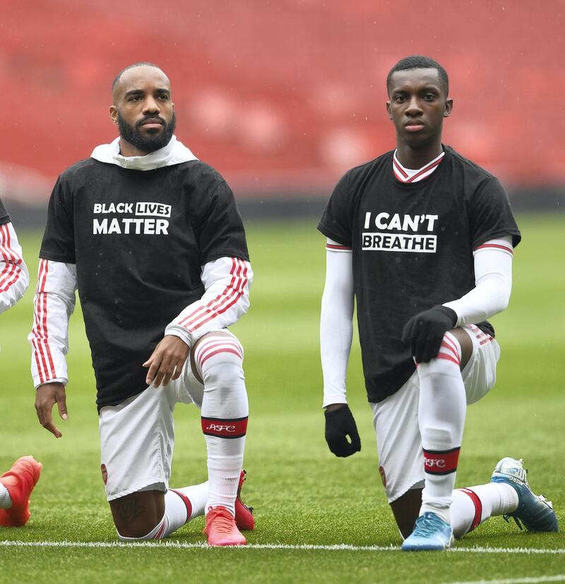 LONDON, ENGLAND - JUNE 10: Alexandre Lacazette and Eddie Nketiah of Arsenal take a knee in support of Black Lives Matter before the friendly match between Arsenal and Brentford at Emirates Stadium on June 10, 2020 in London, England. (Photo by David Price/Arsenal FC via Getty Images)