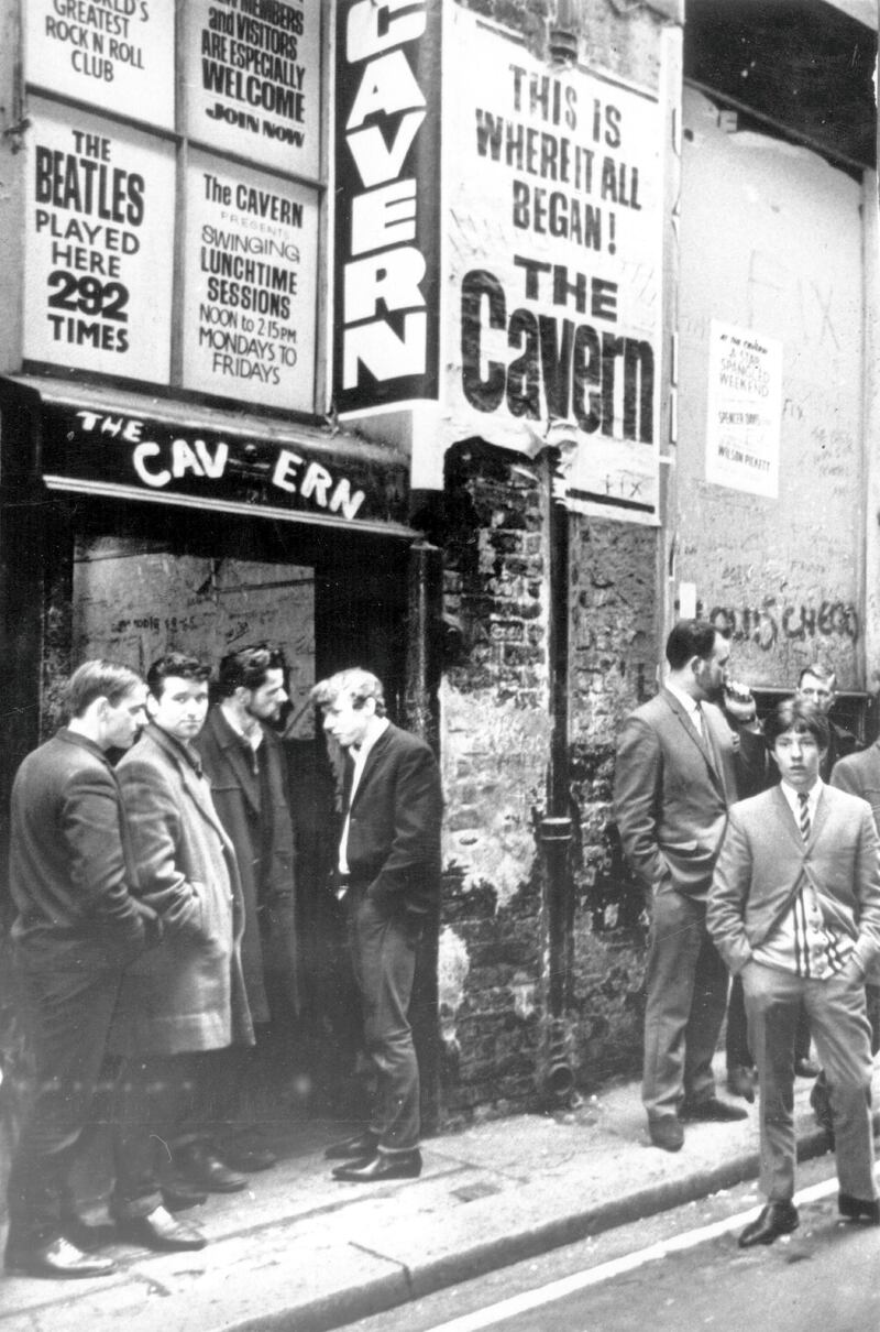 1st March 1966:  Music fans waiting outside the famous Cavern Club music venue in Liverpool, where The Beatles had a residency in the early 1960's.  (Photo by Keystone/Getty Images)