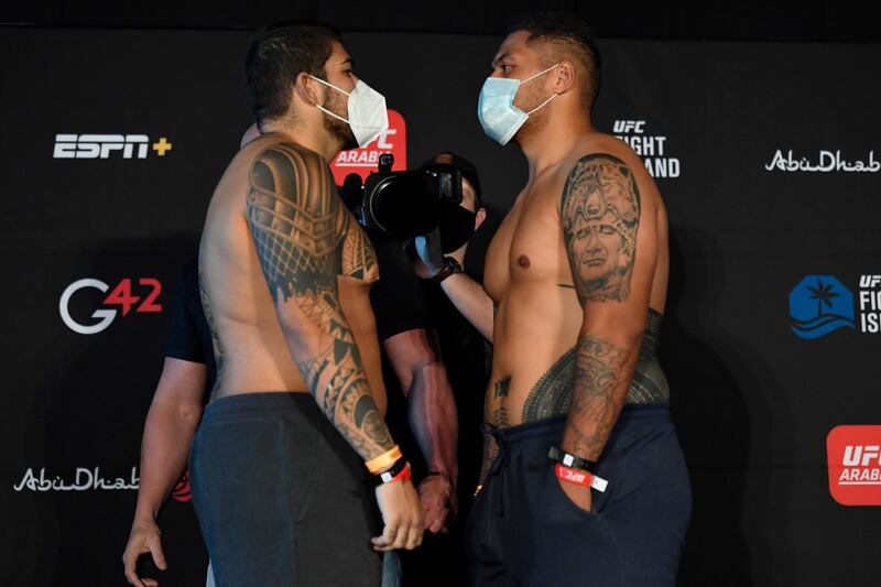 ABU DHABI, UNITED ARAB EMIRATES - JANUARY 15: (L-R) Opponents Carlos Felipe of Brazil and Justin Tafa of Australia face off during the UFC weigh-in at Etihad Arena on UFC Fight Island on January 15, 2021 in Abu Dhabi, United Arab Emirates. (Photo by Jeff Bottari/Zuffa LLC)