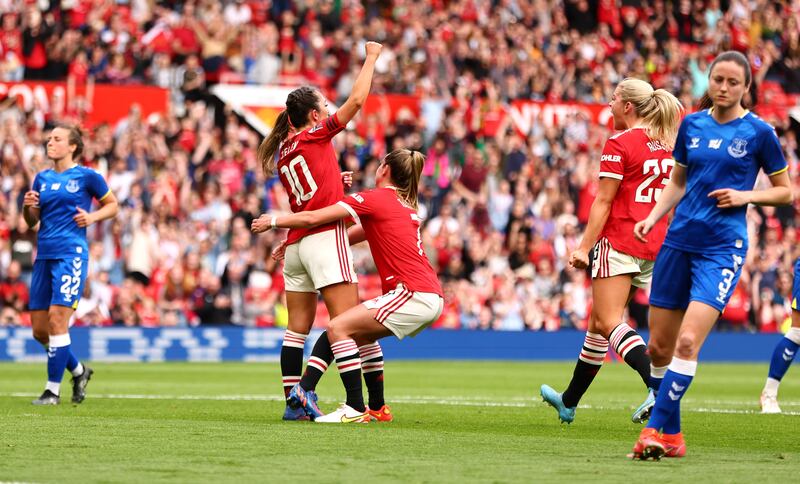 Katie Zelem of Manchester United celebrates with teammates after scoring their second goal from the penalty spot in their 3-1 Women's Super League victory over Everton at Old Trafford on March 27. Getty