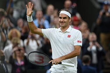 (FILES) In this file photo taken on July 05, 2021 Switzerland's Roger Federer celebrates winning against Italy's Lorenzo Sonego during their men's singles fourth round match on the seventh day of the 2021 Wimbledon Championships at The All England Tennis Club in Wimbledon, southwest London, on July 5, 2021.  (Photo by Glyn KIRK  /  AFP)  /  RESTRICTED TO EDITORIAL USE