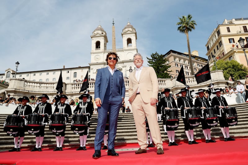 ROME, ITALY - JUNE 19: Top Secret Drum Corps, Tom Cruise and Christopher McQuarrie attend the Red Carpet at the Global Premiere of  "Mission: Impossible - Dead Reckoning Part One" presented by Paramount Pictures and Skydance at The Spanish Steps on June 19, 2023 in Rome, Italy. (Photo by Vittorio Zunino Celotto / Getty Images for Paramount Pictures)