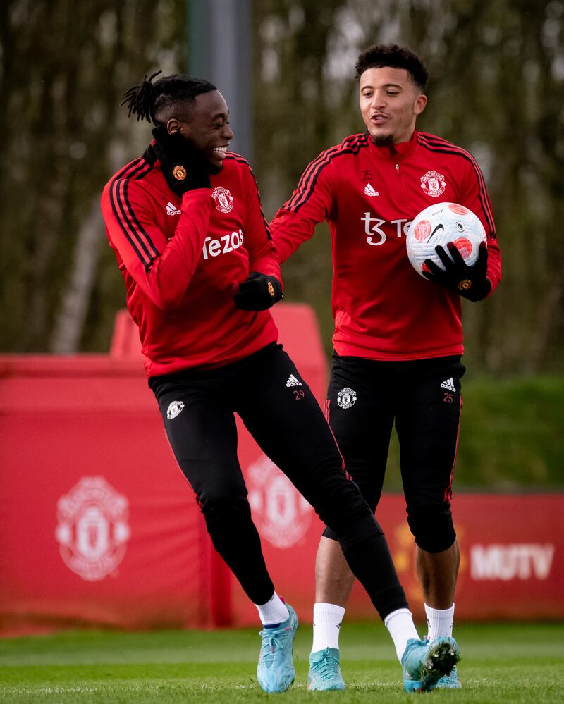 Manchester United's Aaron Wan-Bissaka and Jadon Sancho during training at Carrington ahead of their trip to Everton. 