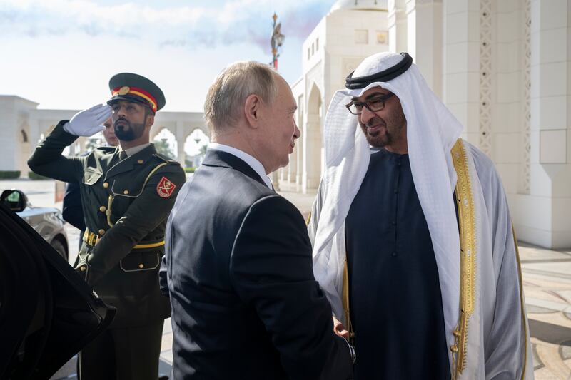 Sheikh Mohamed welcomes Mr Putin during a state visit reception at Qasr Al Watan. Hamad Al Kaabi / Presidential Court