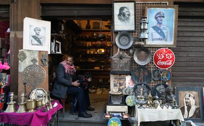 An Egyptian selling crafts and photographs of presidents and kings on Elmoez Lideen Ella street in Old Cairo.  EPA