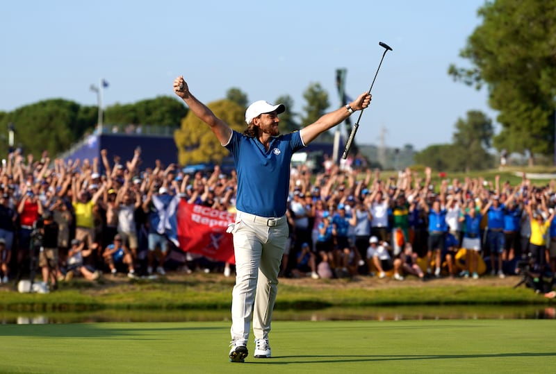 Team Europe's Tommy Fleetwood celebrates his putt during his match against USA's Rickie Fowler to regain the Ryder Cup for Europe. PA