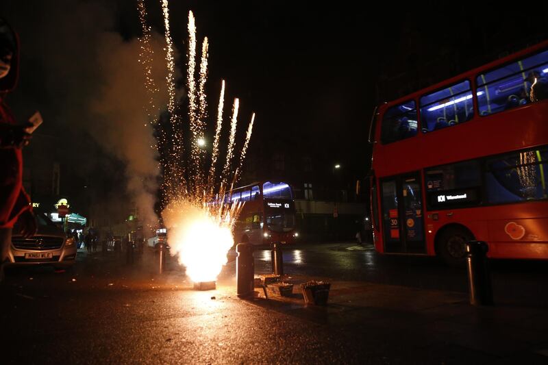 Fireworks are set off on the high street in East Ham, London. Getty Images