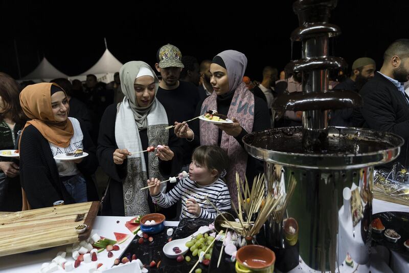 SYDNEY, AUSTRALIA - Attendees of an Iftar function are pictured next to a chocolate fountain  in Sydney, Australia. The annual Iftar dinner hosted by the Giants aims to bring the Western Sydney community together to embrace cultural diversity and celebrate the breaking of the fast during Ramadan.  Getty Images